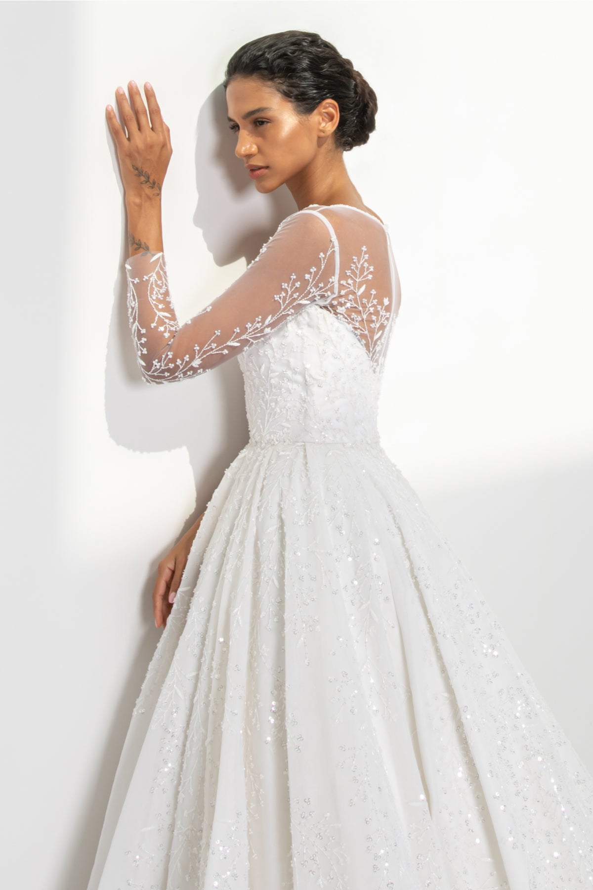 White tulle gown in branches, leaves and floral embellishments