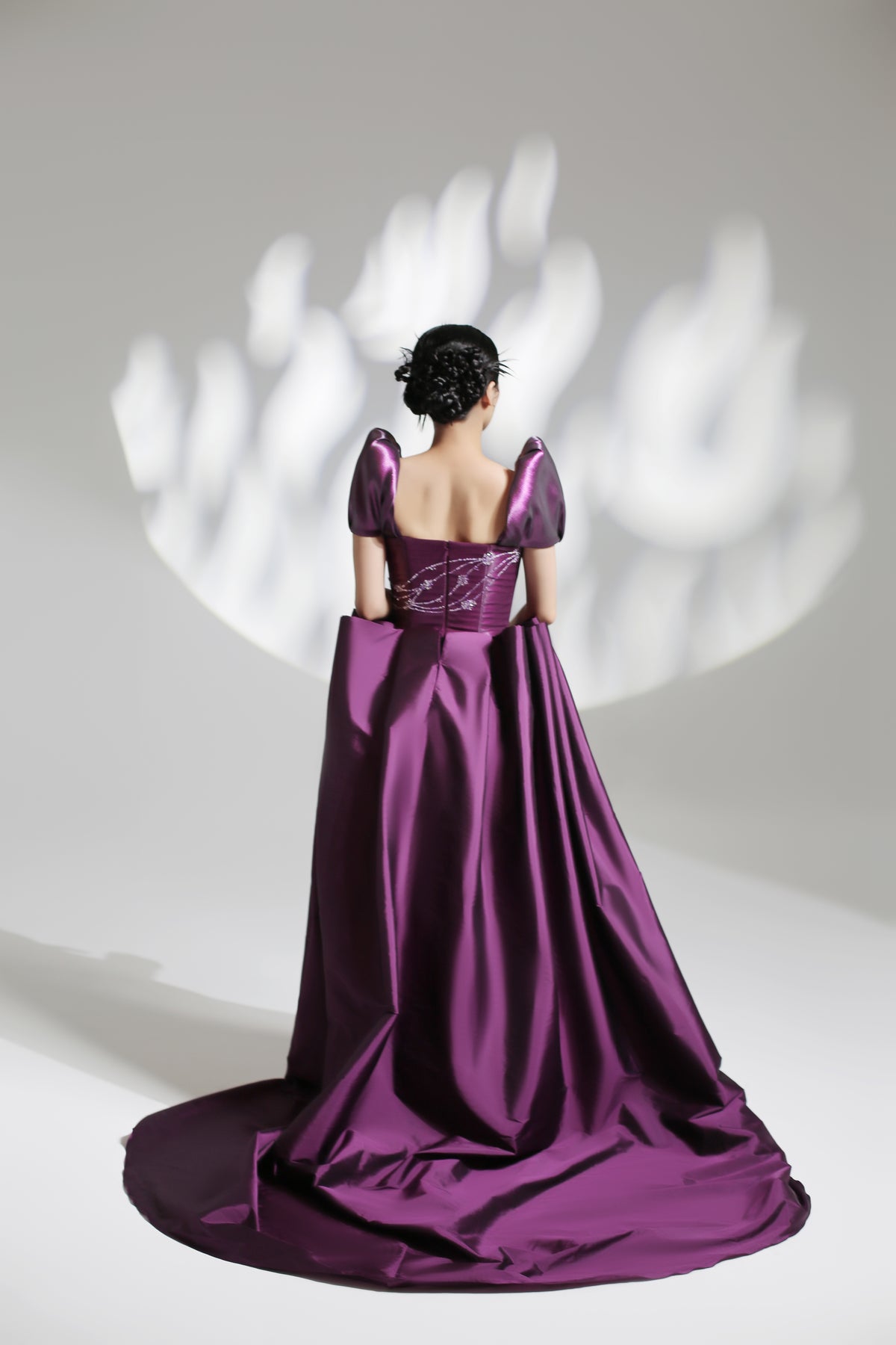 Puff sleeves fitted taffeta dress with draped overskirt